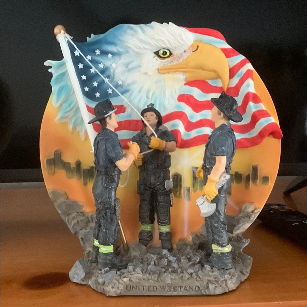 Patriotic Firefighter Sculpture with American Flag